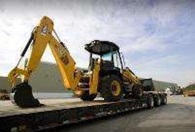 JCB donated backhoe loaders prepare to leave for Haiti.