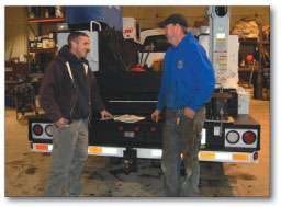 Jeff Covely, left, consults with Kenny Jones, who runs Pioneer Pipe’s shop.