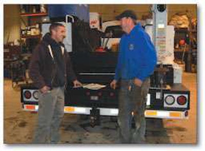Jeff Covely, left, consults with Kenny Jones, who runs Pioneer Pipe’s shop.