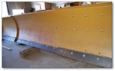 The AggreScreed uses 12 bolts on each side of the blade to adjust the width in 1-foot increments. Go to www.EquipmentWorldDigital.com to hear Mullett further explain AggreScreed.