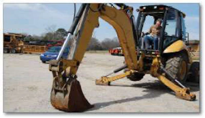 With the backhoe bucket on the ground, move the controls backwards and forwards and side to side, looking for excessive movement in the bucket pins and bushings.