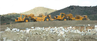 Carrying 22 cubic yards and going 32 miles per hour, a scraper like this can make you a lot of money, or make you broke, in a hurry.