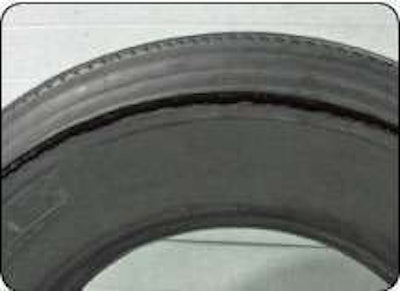 This rupture results from excessive flexing and heat from underinflation or overloading. Not only do the steel cords bend beyond the point where they can easily spring back, but the heat weakens them and the other parts of the casing’s structure.