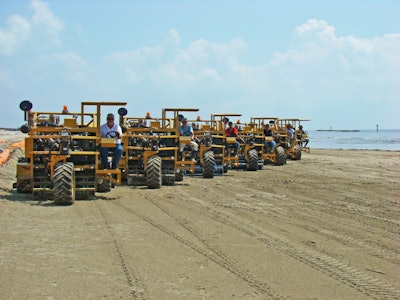 A fleet of Cherrington Beachcleaners prepare for clean-up on the beaches of Grand Isle, Louisiana.
