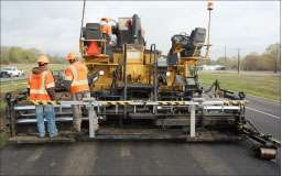 MOBA is among the companies offering smart technology for asphalt pavers. The new MOBA Pave-IR system mounted on the rear of a paver (top) uses a sensor beam to produce a thermal profile of the project. The MOBA-Matic leveling control (left) works in conjunction with other systems.