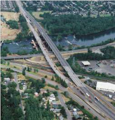 Looking north at I-5, pictured (from left to right) are the work bridge, the decommissioned bridge and the new, temporary detour structure. The decommissioned structure in the photo has since been demolished.