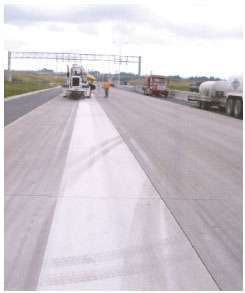 This first-pass, flush-ground surface on I-355 in the Chicago area shows up as the whiter strip on the pavement.