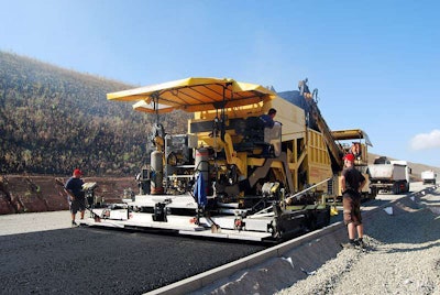 Dynapac’s Compactasphalt system places two lifts of asphalt, hot-on-hot, using a single, large, modified paver and two compacting screeds. Photo courtesy of Dynapac