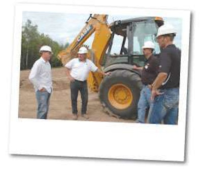From the left, independent test operator Jordan Hess discusses the N Series backhoe loaders with Case product promotion specialist Steve Cudd, chief engineer Wayne Bietz and marketing manager Rob Marringa.
