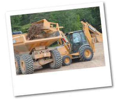 By lengthening the loader by about 4 inches, the N Series backhoe loader can center-load haul trucks, including the 30-metric-ton Case 330B.