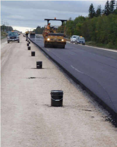 Rollers compact the 50-percent RAP mat on Manitoba PTH 8.