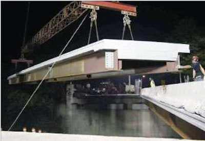 A prefabricated superstructure section of concrete deck on steel girders (bottom) is placed on the Creek Road overpass above I-295 in New Jersey.