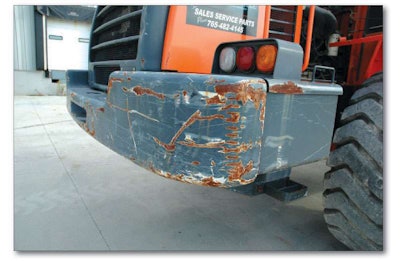 These scratches are more indicative of the demolition use our inspection machine went through than the 650 hours on the meter.