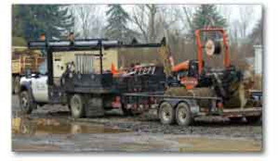 This Ditch Witch was being moved only a couple of blocks but company procedures called for a full set of binders to keep the machine secure on the trailer deck.