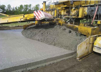 EAC mix is placed in front of the second paver onsite at MnROAD, using a GOMACO GHP-2800 concrete paver model.