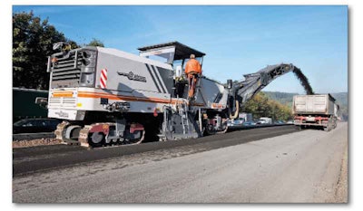 Capable of full-lane milling, the Wirtgen W 250 unveiled at CONEXPO-CON/AGG 2011 has “parallel-to-surface” technology to automatically keep the cold milling machine level as it moves into the cut. An intelligent speed control system includes an electronic flow divider that makes the machine’s four tracks work in harmony when turning.