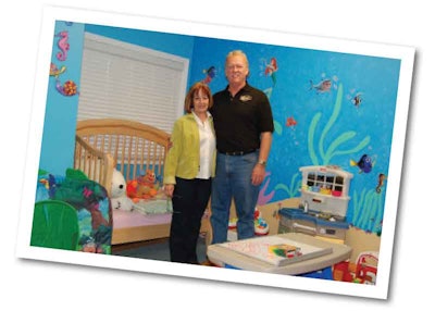 Chuck and wife Rosemary in the nursery they built into their office space so they could stay close to the grandchildren.