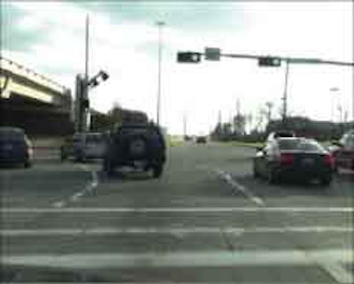 In daylight, lighted pavement markers resemble raised pavement markers as they define the adjacent three left-turn lanes in Sugarland, Texas.