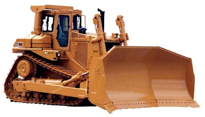 When this Cat D8L was brought in (left picture), it had more than 25,000 hours after being used by a utility company to work their coal stockpile. (The ROPS was removed for transportation purposes.) At right, the rebuilt machine prior to shipping.