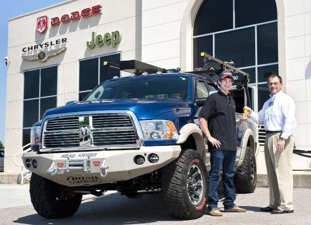 Thomas Ferguson, a Knoxville, Tenn.-based contractor, receives keys from Stephen Abernathy, associate publisher for ProPickup magazine. Ferguson is the winner of the publications 2010 Big Boss contest. The truck is valued at about $75,000