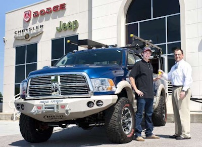 Thomas Ferguson, a Knoxville, Tenn.-based contractor, receives keys from Stephen Abernathy, associate publisher for ProPickup magazine. Ferguson is the winner of the publications 2010 Big Boss contest. The truck is valued at about $75,000
