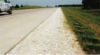 “Daylighted” permeable base – exposed here at the shoulder – is a lower-cost PCC pavement drainable design that doesn’t require separation fabric or drainage systems.