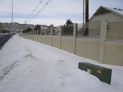 A residential soundwall with tinted brown Soundstop panels in Shiloh, Mont.