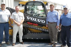 Matt Shoemaker, Chris Sauers, Russ Fairchild and Guy Fairchild of Fairchild Brothers proudly stand in front of their new Volvo MCT135C tracked skid steer loader at the Volvo Construction Equipment dealership, Highway Equipment & Supply Company, in Lock Haven, Pennsylvania.