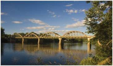The Kennebec River Bridge prior to demolition. It was an eight-span bridge that included four 100-foot tied-arch spans.