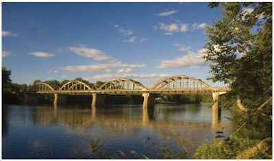 The Kennebec River Bridge prior to demolition. It was an eight-span bridge that included four 100-foot tied-arch spans.