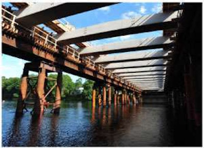 Both the temporary falsework supporting the girder and the precast floor beams were part of the innovative construction sequence to allow the bridge to be built in one year.