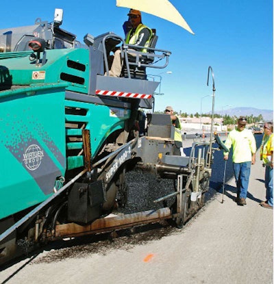 Tack coat eliminated: Movable bars spray polymer-modified emulsion tack coat in advance of thin-lift open-graded UTACS friction course in Clark County, Nev.