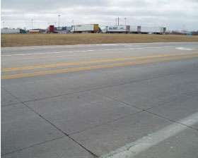 This bonded concrete overlay was placed 4 inches thick on asphalt and sawed into 4-foot-square panels. It’s on U.S. 60 in Neosho, Mo.