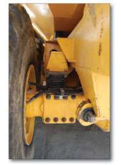 Inspect the axle rubber springs for cracking and separation.