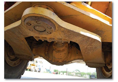 While you’re underneath the machine, look for any hanging wires, broken springs, loose bolts or bad bearings. Caked, oil mud signals a leak.