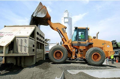 RAP millings from Virginia’s I-81 are fed into adjacent portable cold recycling plant to make foamed asphalt base using 100-percent RAP.