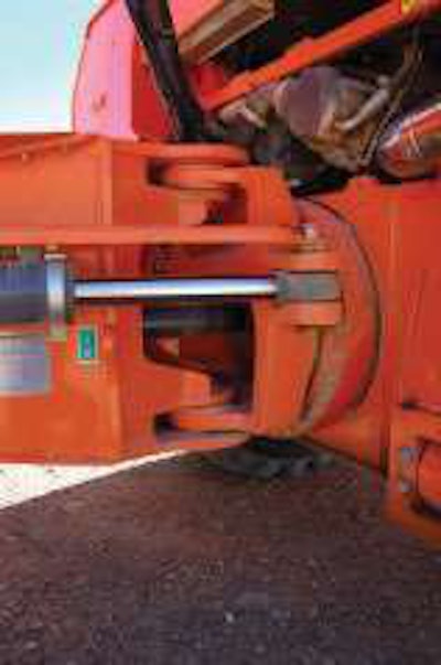 Mounting the turning ring forward of the articulating joint and steering cylinders makes the cab more stable.