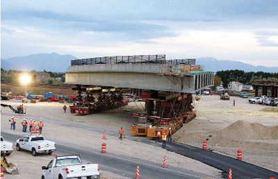 A section of the I-15 Prairie Crossing superstructure is moved toward placement in Utah in October, 2009.