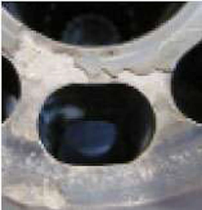 Surface degredation on the pump pressure side caused by fluid contamination.