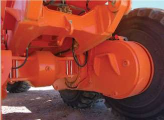 The tandem housing links the rear wheels together in a bogie-like arrangement for improved stability and traction.