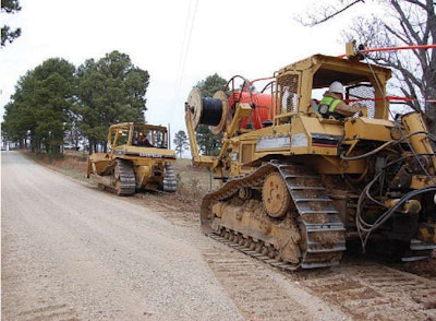 Kelly’s crews laying fiber optic cable.