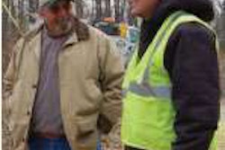 Bruce Vestal, left, a supervisor with Steelville Telephone, with John Kelly at a jobsite in the Steelville area.