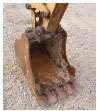 BUCKET — Check the size, linkage and mounts on the bucket and the condition of the quick coupler.