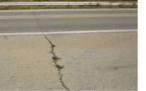 Low-temperature cracking (transverse cracks) may occur when asphalt pavements contract in cold temperatures