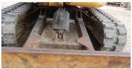 UNDERNEATH — Carefully inspect the machine underneath for major leaks. Also note the condition of the blade.