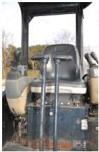 OPERATOR’S STATION — While running the machine, check the operation of all controls and gauges. Make sure the seat adjusts and the seat belt is in good condition. If the cab is enclosed, operate the air conditioning and note any glass, mirror or door latch problems.
