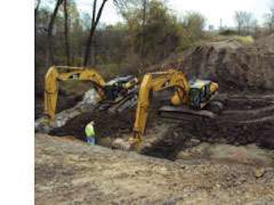 Fye Excavating installed 108-inch, storm-sewer corrugated metal pipes underneath the railroad tracks at the Iowa Army Ammunition Plant in Middletown, Iowa. The culverts are three cells wide and 160 feet long.