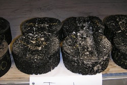 To ensure a pavement mix using recycled asphalt shingles (RAS) isn’t too soft, all mixes in Illinois must be tested with the Hamburg Wheel test. The test uses a 158-pound steel wheel, which is run under water. The specimen is put in a heated water bath and run back and forth 20,000 times
