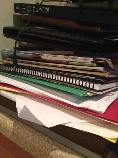 Here is just one of the small piles of papers on my desk that needs to be sorted through and shredded.
