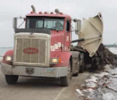 Side-dumps are particularly popular for highway construction, and shoring up levees with rip rap and large rock, as they can quickly lay a row of material on the edge of a road bed.